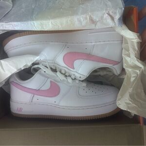 Nike White Low-Top Sneakers with Pink Swoosh